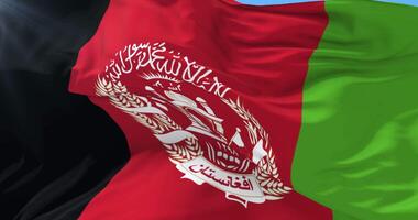 Afghanistani flag waving at wind in slow with blue sky, loop video