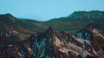 A painting of a mountain range with a blue sky in the background video