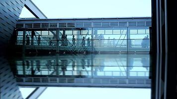 Exploring Modern Urban Architecture with Reflective Surfaces and People Crossing Through video