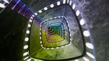 A colorful light is shining through a tunnel video