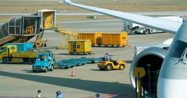 Qatar Doha 06.11.2024 airport Runway Qatar Airways planes loading luggage view from the window Launch zone workers at the airport video