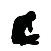 A silhouette of a man sitting down with his head in his hands vector