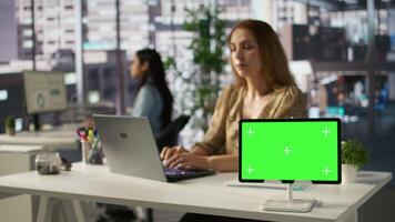 Successful entrepreneur studies enterprise reports next to chroma key display, works on project management and developing a new strategy. Ensuring progress for financial growth. Camera B. video