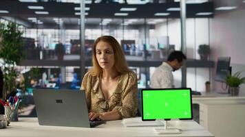 Professional executive analyzing monthly reports with copy space screen, working on strategy planning and financial forecasts. Business developer looking into analytics for decision making. Camera B. video