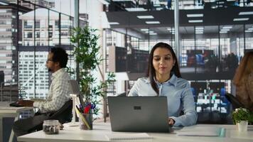 Successful indian entrepreneur working on financial forecasts at his desk, using data and technology to manage business tasks and project development. Company progresses toward its goals. Camera B. video