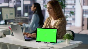 Successful entrepreneur studies enterprise reports next to chroma key display, works on project management and developing a new strategy. Ensuring progress for financial growth. Camera A. video