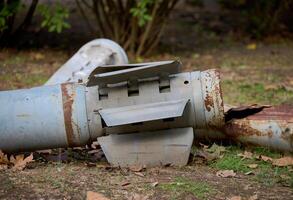 The tail section of a 220 mm rocket for the Uragan rocket fire system on a city flowerbed in Mykolaiv photo