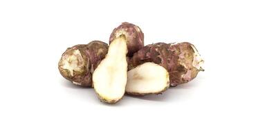 Fresh raw Jerusalem artichokes isolated on white background photo