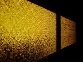 A window with a gold pattern photo