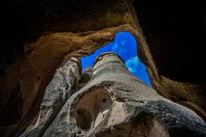 The view from inside a cave in the rock formation photo