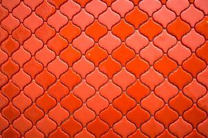 Orange tile background with a pattern of squares photo