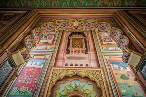 The colorful wall of a building with intricate designs photo