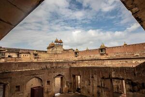 The view from inside the courtyard of a building photo