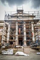 A large building with scaffolding around it photo