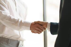 Businessman shaking hands successful making a deal. mans handshake. Business partnership meeting concept photo