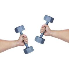 Iron dumbbell in man's hand isolated on white background. photo