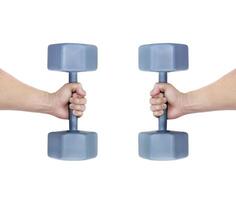 Iron dumbbell in man's hand isolated on white background. photo