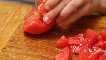 Chopping Tomatoes on a Wooden Cutting Board video