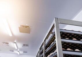 Ceiling of factory interrior ventilation with low temperature of an industrial eggs storage room. photo