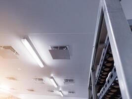Ceiling of factory interrior ventilation with low temperature of an industrial eggs storage room. photo