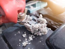 Terminal battery broken,The white powder that is on the head of the car battery is a fungus that appears due to an alternator overcharge which can cause overheating at the positive pole. photo