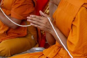 In the morning the monks walk for alms with the Buddhists, offering food to the monks with devotion. photo