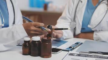 Team, medical analysts and doctors consulting with paperwork of graphs, data and charts in hospital conference room. Closeup of healthcare staff discussing statistics, results and innovation strategy video