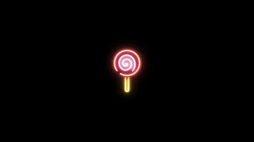 Neon sign in candy shape motion graphic with alpha channel. Colored candy neon light turn on and turn off isolated icon animated on transparent background. 01 video