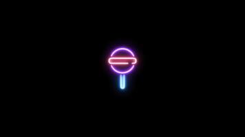 Neon sign in candy shape motion graphic with alpha channel. Colored candy neon light turn on and turn off isolated icon animated on transparent background. 02 video