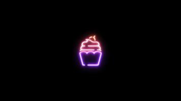 Neon sign in cupcake shape motion graphic with alpha channel. Colored cupcake neon light turn on and turn off isolated icon animated on transparent background. video