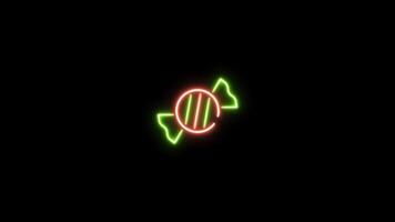Neon sign in candy shape motion graphic with alpha channel. Colored toffee neon light turn on and turn off isolated icon animated on transparent background. video