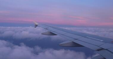 plane sky clouds travel wing sunrise airplane flight video
