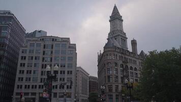 The buildings lined up along Purchase Street in Downtown Boston create a striking scene, set against the monumental backdrop of the Custom House Tower. video