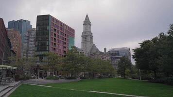 The Rose Fitzgerald Kennedy Greenway is a scenic, linear park spanning several neighborhoods in Downtown Boston, framed by the historic Custom House Tower in the background. video
