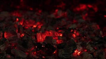 Smoldering and hot coals of burned wood in the fireplace video