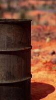 old empty rusted barrel on sand video