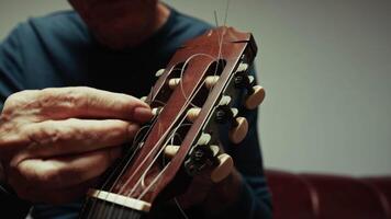 Man Changing The Strings Of The Guitar video