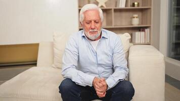 Pain on heart, heart attack. Unhappy middle aged senior man suffering from chest pain heart attack problems with health at home. Mature old senior grandfather touching chest experiencing infarction video