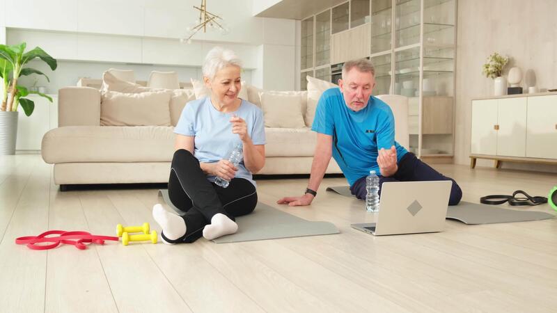 Yoga mindfulness water. Senior adult mature couple drinking water after practicing yoga with online lessons in laptop. Old wife husband drink water before workout. Family doing sports exercise at home 52191209 Stock Video at Vecteezy