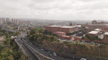 Yerevan, Armenia - 20th october, 2024- aerial zoom in view Yerevan Ararat Brandy Factory buildings. Ararat museum. Vehicles in traffic on M5 highway video