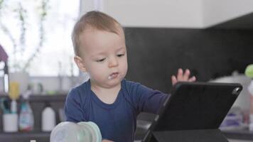 Toddler interacting with tablet computer video