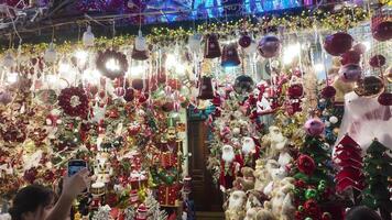 Shop full of holiday decorations and toys for New Year's and Christmas preparations, Christmas shopping in Hanoi, Vietnam video