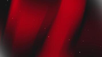 Red and black gradient background with scattered dots. video