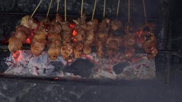 Top view or flat lay view process of making Indonesian chicken satay in traditional way. video