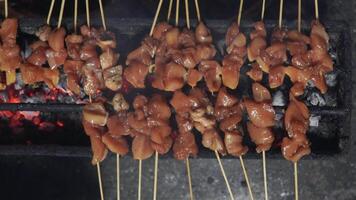 Top view or flat lay view process of making Indonesian chicken satay in traditional way. video
