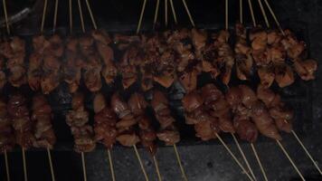 Top view or flat lay view process of making Indonesian chicken satay in traditional way. video