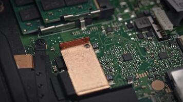 Close up of a motherboard with various electronic components and circuit parts video