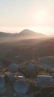 An aerial view of a satellite dish in the middle of a mountain video