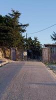 A gate is open in front of a house video