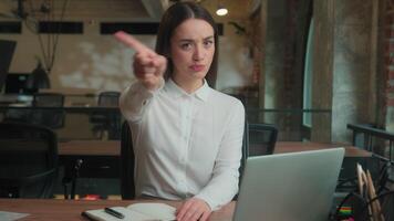 Female businesswoman lady Caucasian business woman serious strong girl office manager student grimace face waving finger dissatisfied angry no disagree not reject disapprove deny gesture reject forbid video